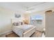 Main bedroom with white furniture and ocean view at 7 Elgin Pl # 512, Dunedin, FL 34698