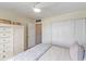 Bedroom with white built-ins and ceiling fan at 7 Elgin Pl # 512, Dunedin, FL 34698