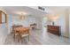 Dining room features wood table and light wood floors at 7 Elgin Pl # 512, Dunedin, FL 34698