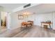 Dining room with mid-century modern furnishings and hardwood floors at 7 Elgin Pl # 512, Dunedin, FL 34698