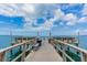 Fishing pier with benches overlooking the water at 7 Elgin Pl # 512, Dunedin, FL 34698