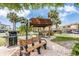 Relaxing BBQ area with picnic tables at 7 Elgin Pl # 701, Dunedin, FL 34698