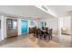 Dining area with a dark wood table and six chairs, adjacent to the kitchen at 7 Elgin Pl # 701, Dunedin, FL 34698