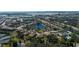 Aerial view of community with lake and lush landscaping at 7402 Hamilton Rd, Bradenton, FL 34209