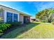 Backyard with screened patio and lush landscaping at 7402 Hamilton Rd, Bradenton, FL 34209