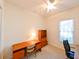 Home office with wood desk, bookcase and ceiling fan at 7402 Hamilton Rd, Bradenton, FL 34209