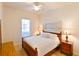 Main bedroom with wood furniture and ceiling fan at 7402 Hamilton Rd, Bradenton, FL 34209