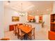 Bright dining room with a wood table and chairs, adjacent to the kitchen at 7402 Hamilton Rd, Bradenton, FL 34209