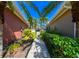 Landscaped walkway between two houses, leading to a gate at 7402 Hamilton Rd, Bradenton, FL 34209