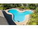 Inviting community pool with plenty of lounge chairs for sunbathing at 7402 Hamilton Rd, Bradenton, FL 34209