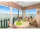 Dining area with water view; table for two with chairs at 868 Bayway Blvd # 312, Clearwater Beach, FL 33767