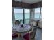 Bright dining room with table and chairs, water view at 868 Bayway Blvd # 312, Clearwater Beach, FL 33767