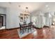 Elegant dining room features hardwood floors and pool view at 9203 Sea Oaks Ct, Seminole, FL 33776