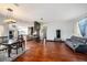 Bright dining room with hardwood floors, chandelier, and table for six at 9203 Sea Oaks Ct, Seminole, FL 33776