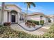 House exterior showing walkway, landscaping, and garage at 9203 Sea Oaks Ct, Seminole, FL 33776