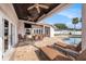 Relaxing pool patio with seating and dining areas at 9203 Sea Oaks Ct, Seminole, FL 33776