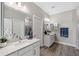 Modern bathroom with double vanity and a large walk-in shower at 9846 Red Bay Loop, Land O Lakes, FL 34637