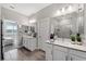 Elegant bathroom boasting double sinks and a view of the bedroom at 9846 Red Bay Loop, Land O Lakes, FL 34637