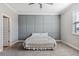 Spacious bedroom with gray accent wall and carpeted floor at 9846 Red Bay Loop, Land O Lakes, FL 34637