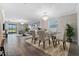 Elegant dining room features a glass table and neutral decor at 9846 Red Bay Loop, Land O Lakes, FL 34637