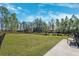 Fenced dog park with grassy area and bench at 9846 Red Bay Loop, Land O Lakes, FL 34637