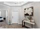 Light and airy foyer with hardwood floors and console table at 9846 Red Bay Loop, Land O Lakes, FL 34637