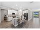 Modern kitchen with white cabinets, island, and stainless steel appliances at 9846 Red Bay Loop, Land O Lakes, FL 34637