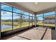 Screened porch overlooking a pond and other homes at 9846 Red Bay Loop, Land O Lakes, FL 34637