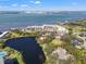 Aerial view showcasing waterfront property and location at 1 Gallinule Pl, Belleair, FL 33756