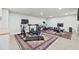 Home gym with a variety of equipment and plenty of space at 1 Gallinule Pl, Belleair, FL 33756