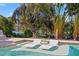 Relaxing pool with in-water loungers, offering a tranquil escape at 1 Gallinule Pl, Belleair, FL 33756