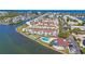 Aerial view of community, showcasing waterfront location and amenities at 1 Windrush Blvd # 100, Indian Rocks Beach, FL 33785