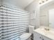 Clean bathroom with white vanity and shower/tub combo at 1 Windrush Blvd # 100, Indian Rocks Beach, FL 33785