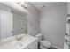 Simple bathroom with a white vanity and shower at 1 Windrush Blvd # 100, Indian Rocks Beach, FL 33785