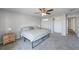 Bright bedroom featuring a king-size bed and large closet at 1 Windrush Blvd # 100, Indian Rocks Beach, FL 33785