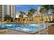 Resort-style pool with lounge chairs and umbrellas at 100 1St N Ave # 503, St Petersburg, FL 33701