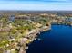 High-angle view of waterfront home showcasing expansive lake views at 10106 Tarpon Springs Rd, Odessa, FL 33556