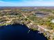 Aerial view of lakefront property highlighting its serene waterfront location at 10106 Tarpon Springs Rd, Odessa, FL 33556