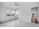 Bright bedroom with window and carpet flooring at 10106 Tarpon Springs Rd, Odessa, FL 33556