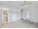 Bedroom with ensuite bathroom and mirrored closet doors at 10106 Tarpon Springs Rd, Odessa, FL 33556