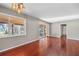 Bright dining room with hardwood floors and view to backyard at 10106 Tarpon Springs Rd, Odessa, FL 33556