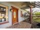 Inviting front door entrance with a brick walkway, a charming entryway at 10106 Tarpon Springs Rd, Odessa, FL 33556