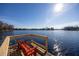 Relaxing lakefront dock with bench, offering serene water views at 10106 Tarpon Springs Rd, Odessa, FL 33556