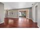 Bright living room with hardwood floors and sliding doors leading to the patio at 10106 Tarpon Springs Rd, Odessa, FL 33556