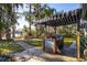 Outdoor patio with built-in grill and lake view at 10106 Tarpon Springs Rd, Odessa, FL 33556