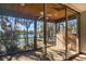 Relaxing screened porch overlooking a tranquil lake at 10106 Tarpon Springs Rd, Odessa, FL 33556