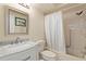 Clean bathroom with shower/tub combo, vanity, and mirror at 1084 Dunrobin Dr # D, Palm Harbor, FL 34684