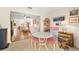 Bright dining area with table and chairs, view into living room at 1084 Dunrobin Dr # D, Palm Harbor, FL 34684