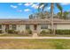 Front view of a condo with walkway and landscaping at 1084 Dunrobin Dr # D, Palm Harbor, FL 34684