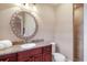 Bathroom with a vanity featuring granite counters and a tiled walk-in shower providing modern convenience at 1097 Eden Isle Ne Dr, St Petersburg, FL 33704